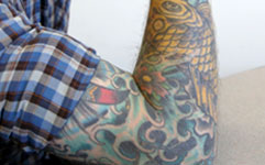 man's arm with body art
