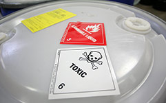 Drum with hazardous waste stickers