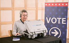 a person using an accessible voting machine