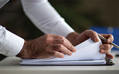 man looking at notes