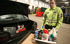 Unloading household hazardous waste at drop-off facility