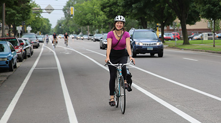 Woman riding her bicycle on a road