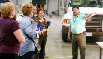 presenter talking with group at Public Works facility