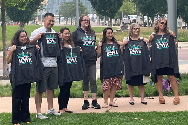 ARS employees don shirts with the phrase “Protect ICWA” at an event to raise awareness about threats to the federal Indian Child Welfare Act (ICWA).