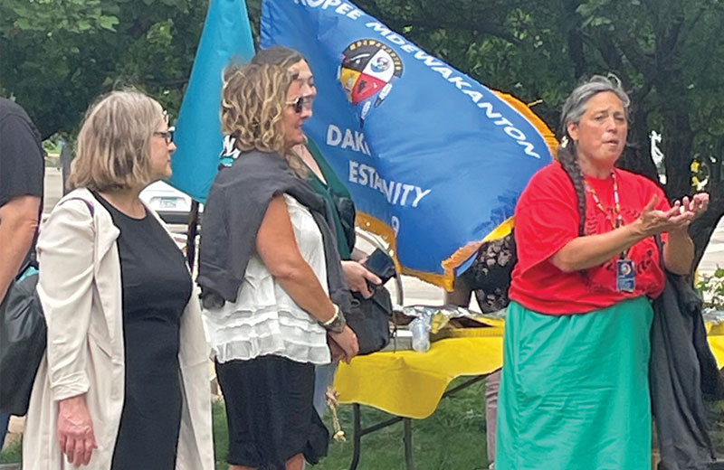 ARS principal attorney Jessica Ryan, with colleagues by her side, speaks at a community event celebrating a U.S. Supreme Court decision upholding the Indian Child Welfare Act (ICWA).