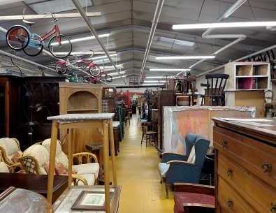 An interior space showcasing an assortment of furniture and decor items.