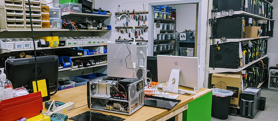 Interior of Free Geek showing a desk and a lot of technology equipment
