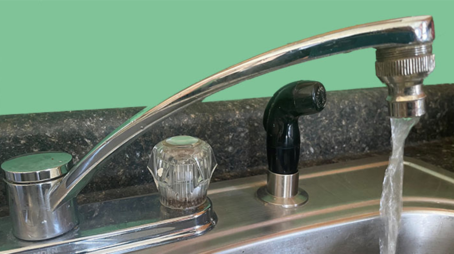 Tap on sink with running water