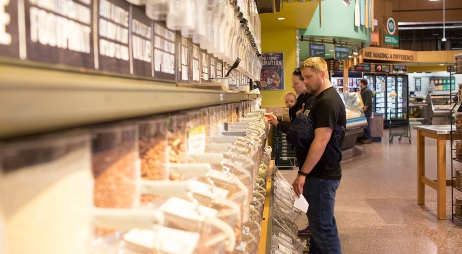 Person standing in the bulk section of a co-op