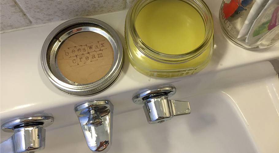 jar of beeswax on bathroom sink