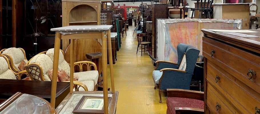 An interior space showcasing an assortment of furniture and decor items.