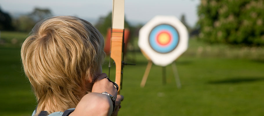 Child shooting arrow at a target