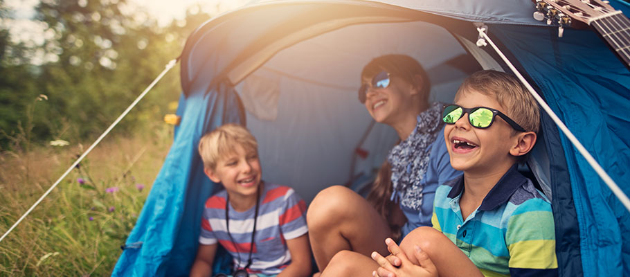Kids laughing in a tent