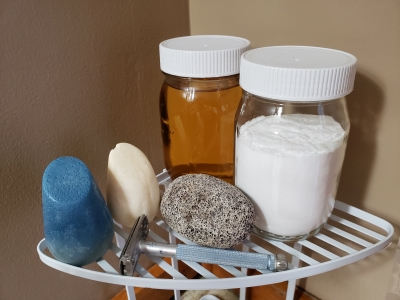 Shampoo bars and jars of soap and shampoo in shower