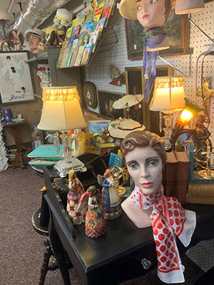 Antique display showing scarves and home goods