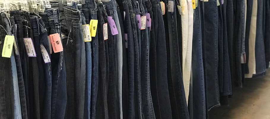 Jeans hanging on clothes rack at Arc's Value Village