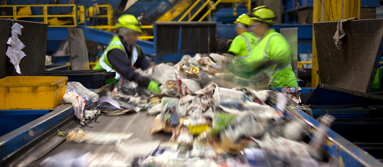 Blurred photo of conveyor belt in recycling facility