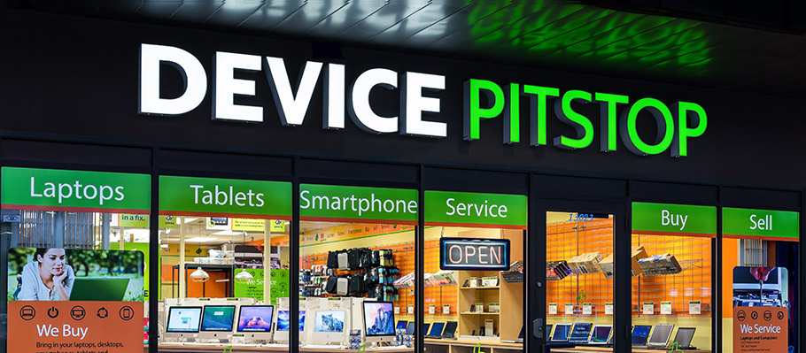 Storefront of Device Pitstop at night