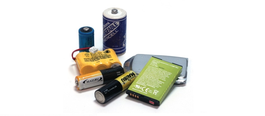 Grouping of several types of rechargeable batteries on white background