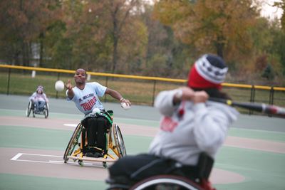 Kids playing baseball in wheelchairs