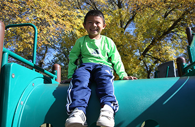 Boy sitting on playground