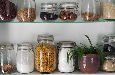 Kitchen shelf with jars of pantry staples