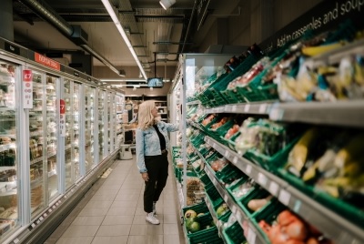 Woman looking at shelves in grocery store