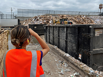 Young woman in waste facility