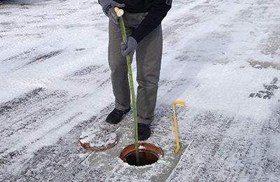 Emergency Management staff monitoring for frost depth