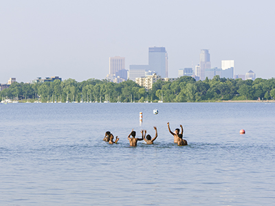 Group of people playing ball in a lake