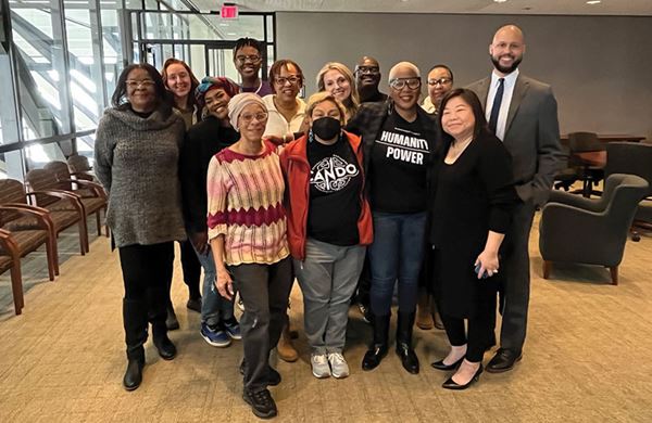 group photo in the board room of Hennepin county