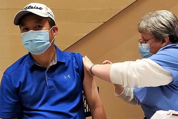 Community member receiving COVID-19 vaccination