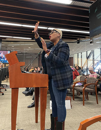 women speaks to the hennepin county board