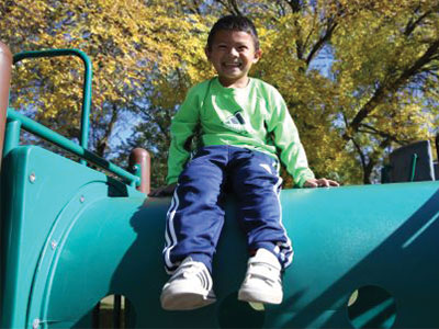Child of color on a slide