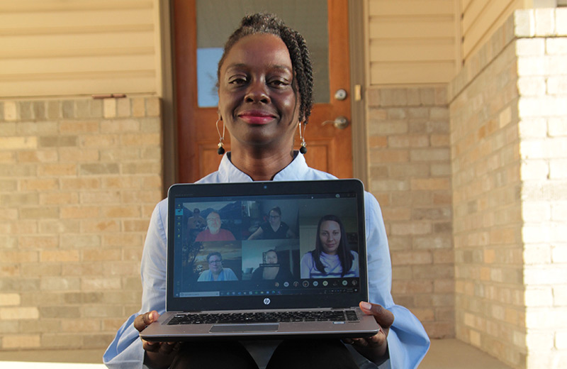 african american women holding laptop