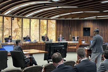 man talking to the hennepin county board