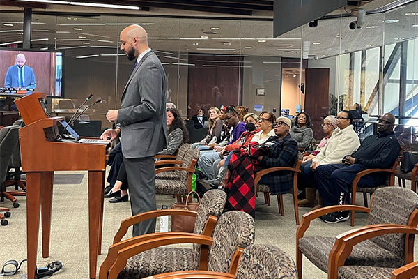 man speaks to the hennepin county board