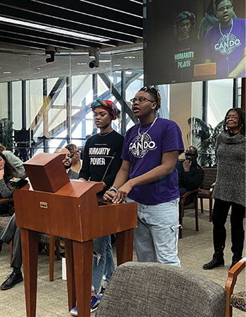 two youth workers sharing experiences at the board meeting