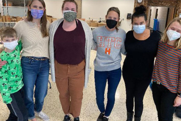 members of the hennepin technical college stand for a photo