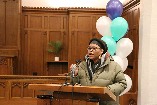 angela conley speaking at the podium