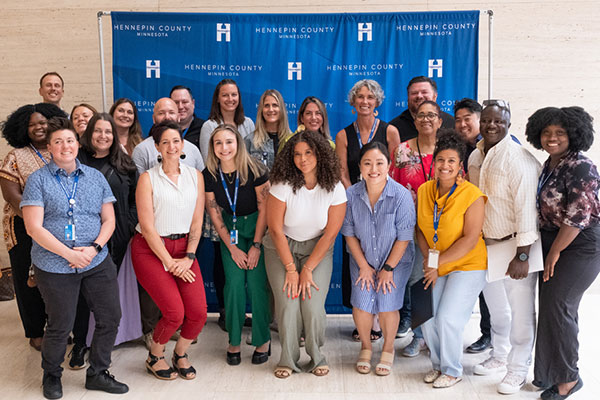 group of people inside posing for a photo