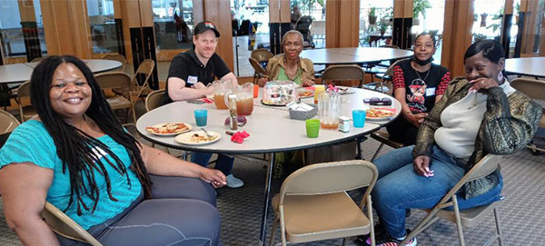 people sitting at a table for a meeting