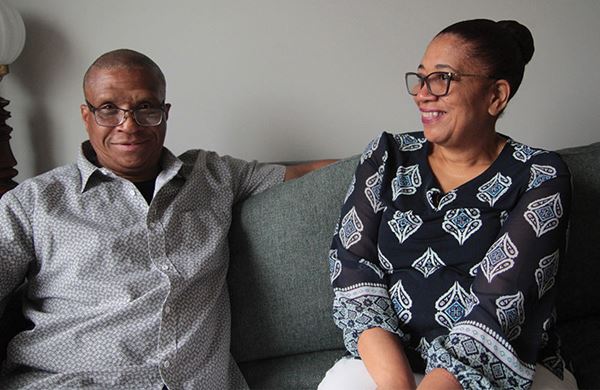 women and man sitting on a couch