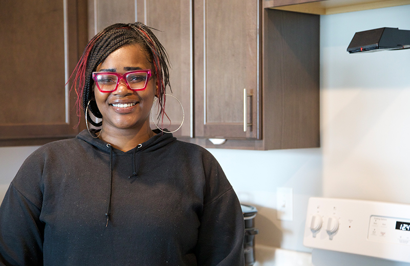 women standing in her house