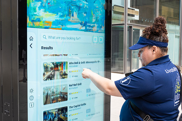 women using kiosk outside in downtown minneapolis